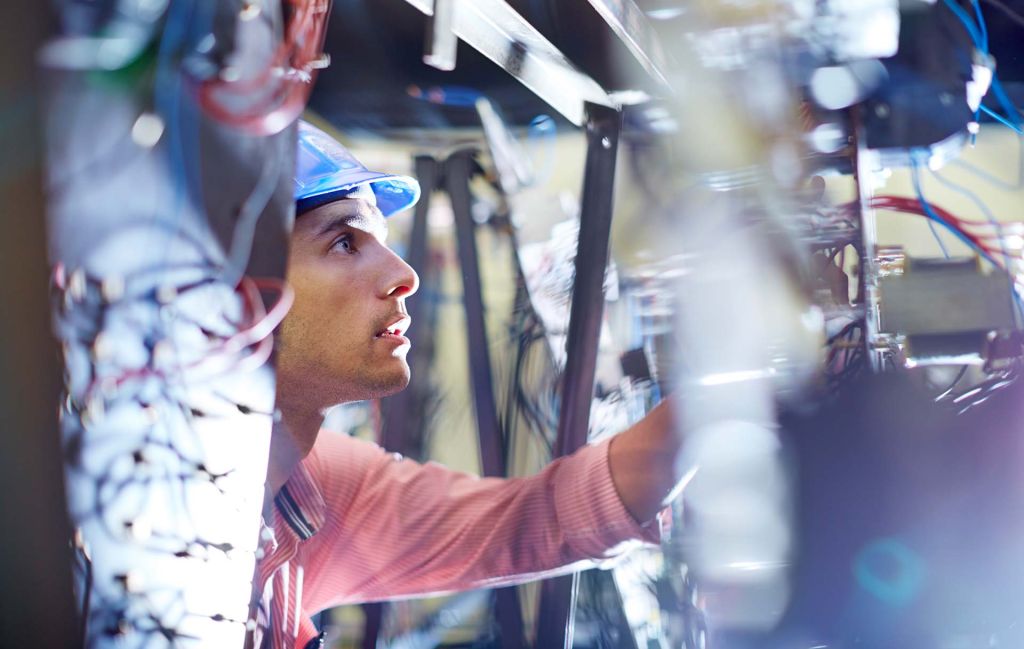 Electrical Engineer inspecting components