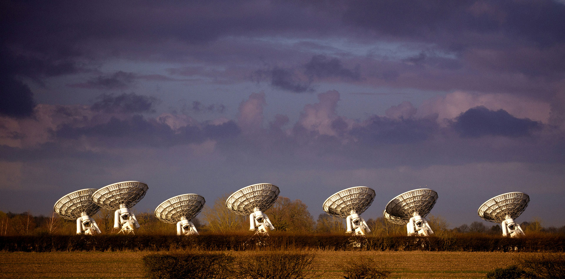 Radars against a cloudy sky