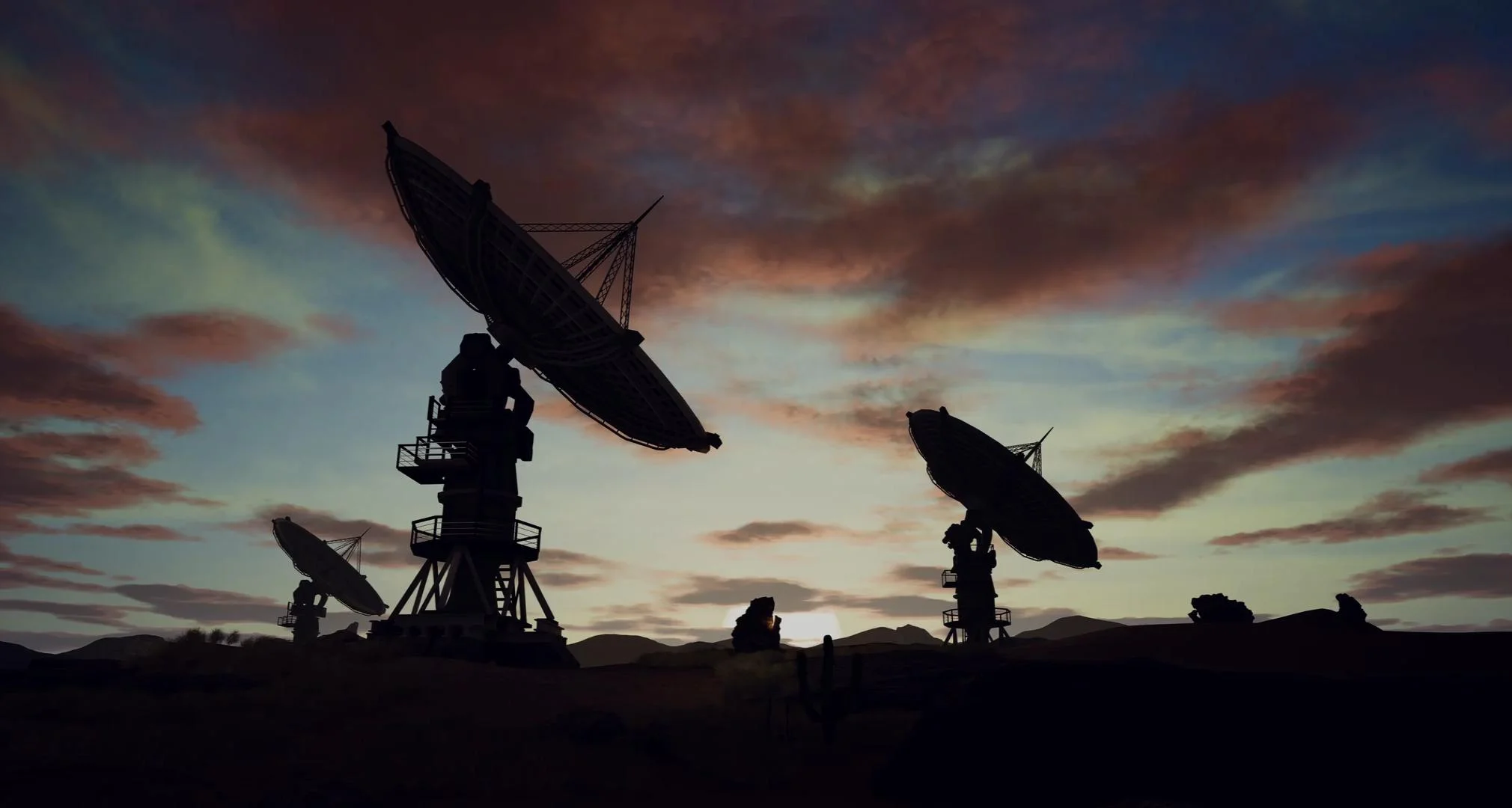 Satellite Dishes On Field Against Cloudy Sky
